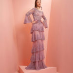 Light purple fully beaded dress with tiered ruffles and flared sleeves.