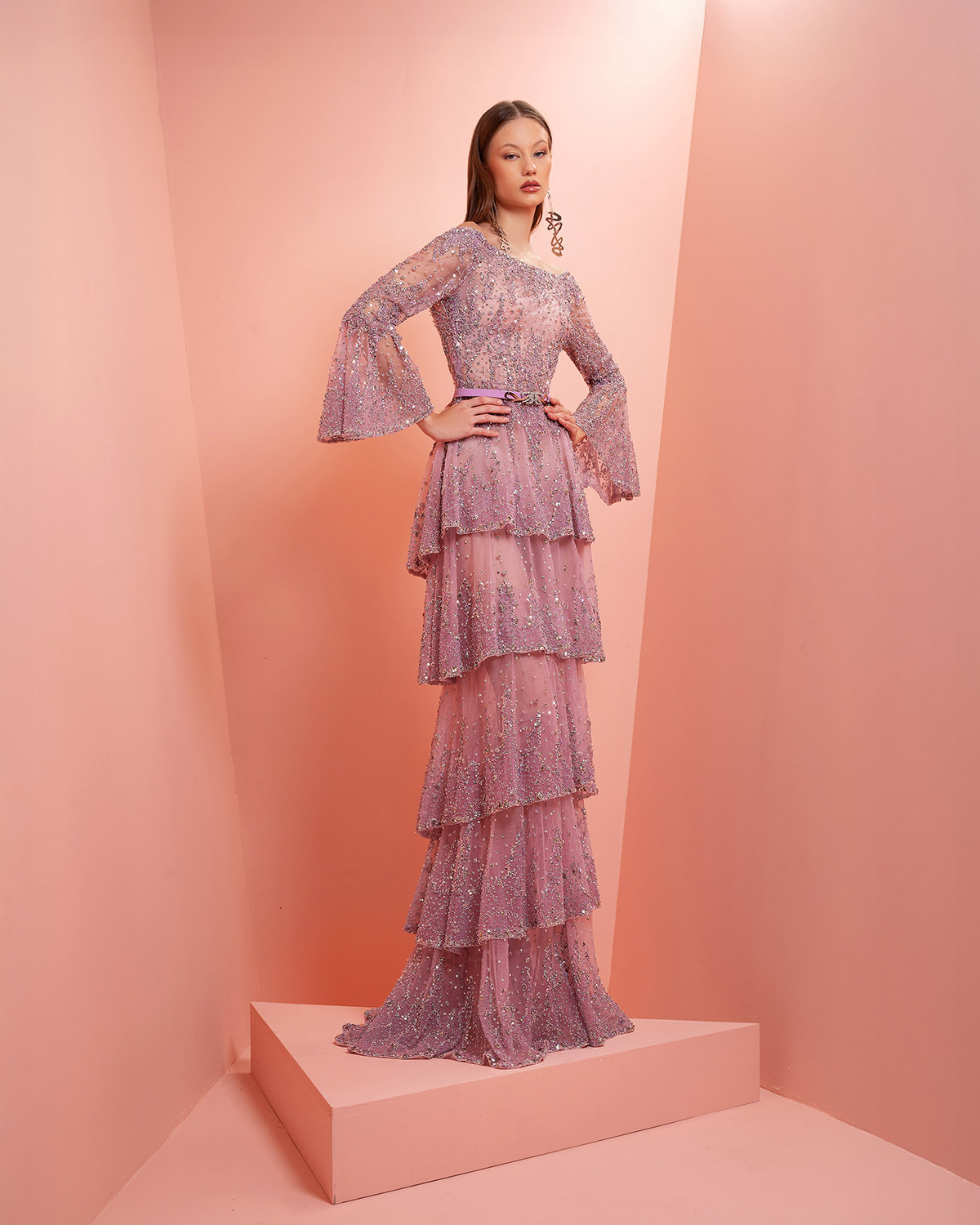 Light purple fully beaded dress with tiered ruffles and flared sleeves.