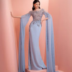 Blue beaded dress with long sleeve scarves