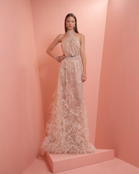 Off - white beaded dress with feathers