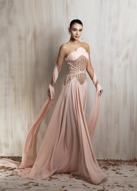 Blush strapless gown with a structured embellished corset
