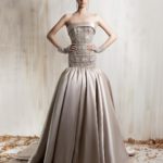 Strapless beige beaded bodice ball gown with  voluminous satin skirt and short beaded gloves