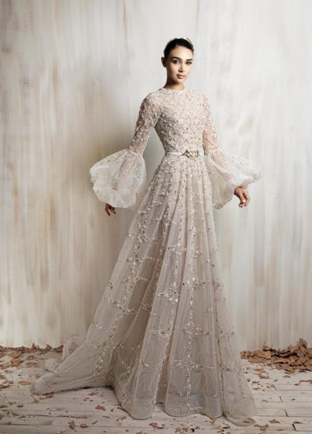 Ivory beaded long sleeve gown with sheer  voluminous sleeves