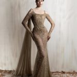 Bronze beaded mermaid gown with sheer sleeves and  musslin shoulder shawl