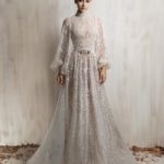 off - white high-neck beaded gown with sheer long sleeves