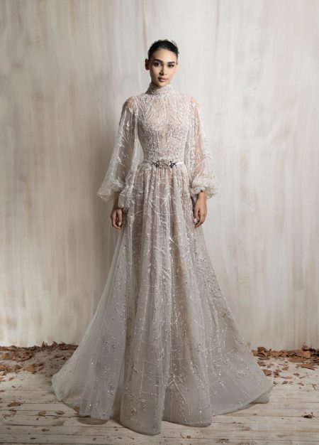 off - white high-neck beaded gown with sheer long sleeves