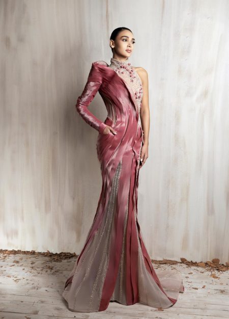 Rose pink sculpted satin gown with sheer beaded panels and one-shoulder sleeve