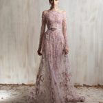 Blush pink embroidered tulle gown with sheer sleeves and fitted silhouette