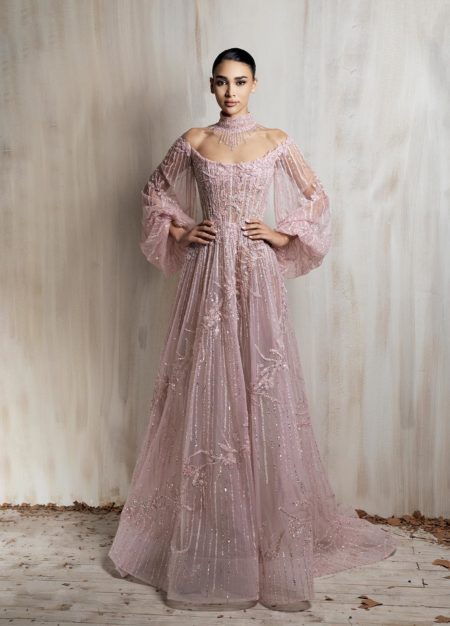 Soft blush pink beaded tulle gown with off-shoulder neckline and voluminous sleeves