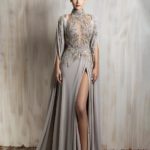 Taupe embellished gown with high slit and flowing cape sleeves