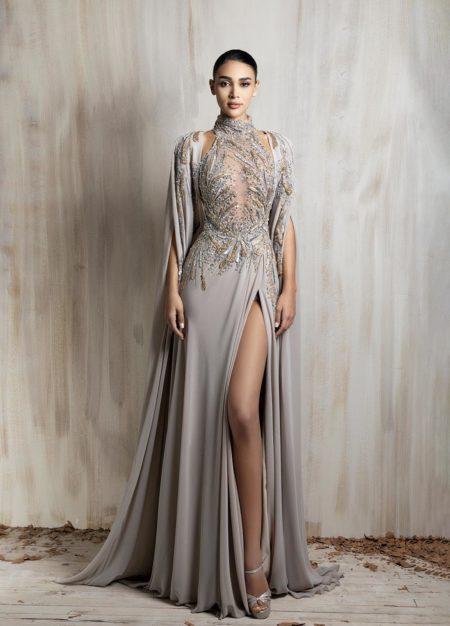 Taupe embellished gown with high slit and flowing cape sleeves