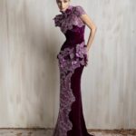 Plum velvet gown with floral embellishments and sculpted silhouette