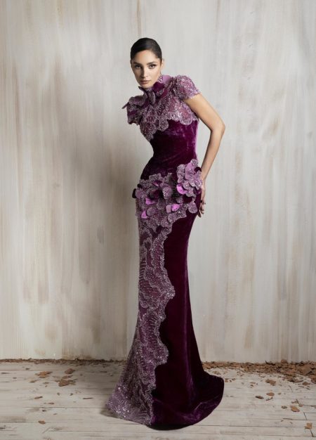 Plum velvet gown with floral embellishments and sculpted silhouette