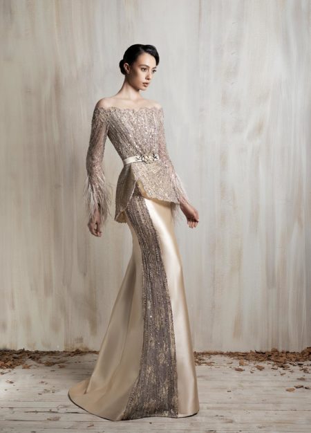 Off-shoulder champagne gown with a sculpted peplum bodice