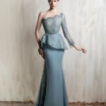 One-shoulder icy blue gown with a beaded corset bodice