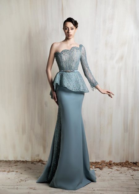 One-shoulder icy blue gown with a beaded corset bodice