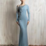 Long-sleeve icy blue gown with a sleek fitted silhouette