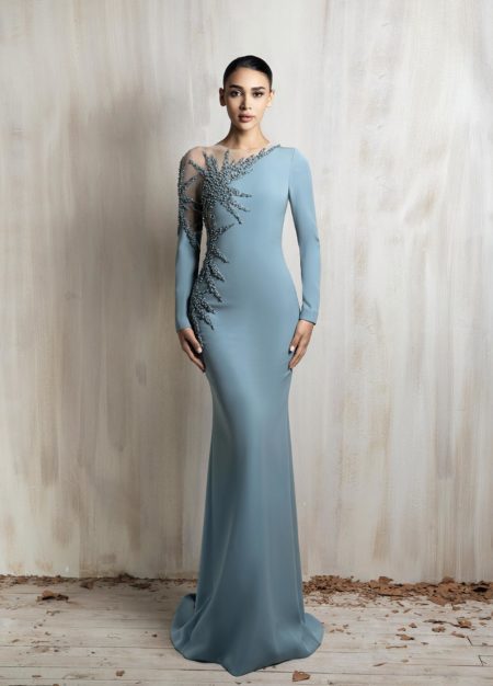 Long-sleeve icy blue gown with a sleek fitted silhouette