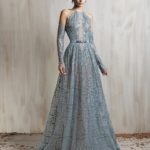 High-neck sheer aqua gown with intricate beaded embroidery