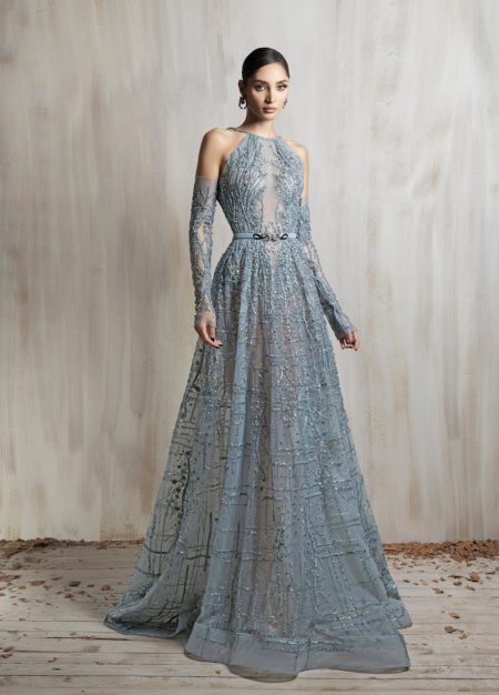 High-neck sheer aqua gown with intricate beaded embroidery
