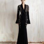Black long-sleeve gown with lace bodice and deep neckline.