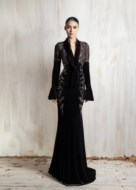 Black long-sleeve gown with lace bodice and deep neckline.