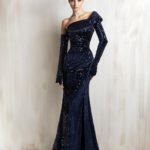 Navy sequined off-shoulder mermaid gown with gloves sleeve.