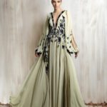 Flowing sage chiffon gown with floral embellishments.
