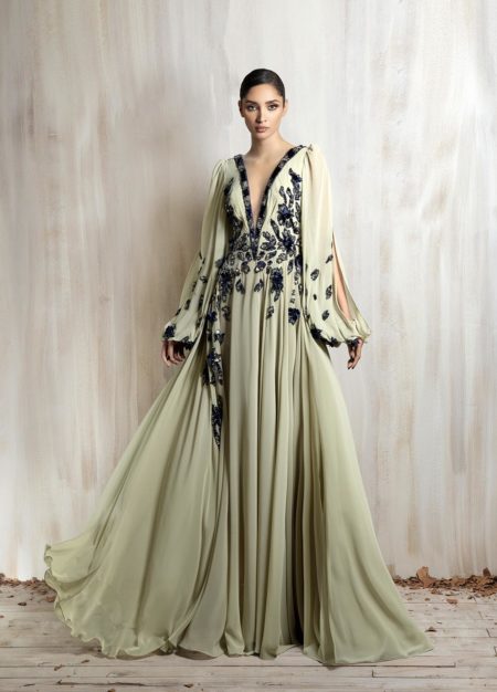 Flowing sage chiffon gown with floral embellishments.
