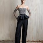 Crystal-embellished bodice with tailored black wide-leg trousers.