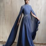 Royal blue cape gown with crystal-embellished cape.