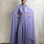 Lavender cape gown with radiant crystal neckline.