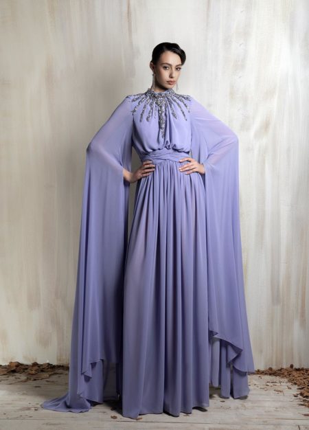 Lavender cape gown with radiant crystal neckline.